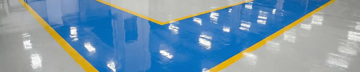 A factory floor professionally covered and marked with epoxy flooring in Bellevue, WA