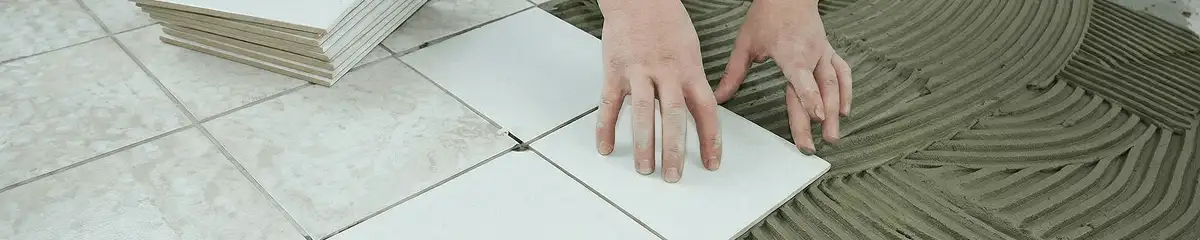 Professional installing white tile floors in Bellevue, WA