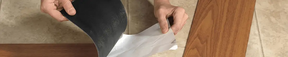 A professional installing vinyl flooring in Bellevue, WA